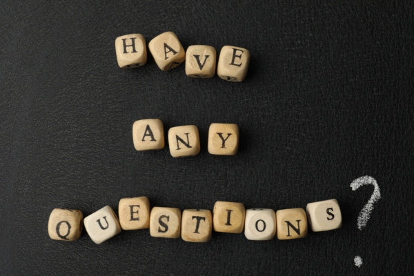 have any questions spelled using wooden letter cubes depicting FAQs