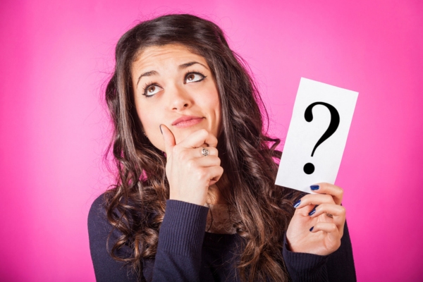 woman wondering while holding question mark sign depicting stack effect