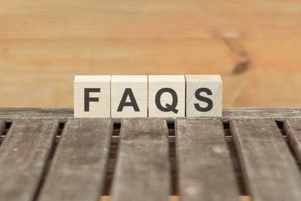 FAQS spelled using wooden chips depicting questions about Spray Foam Vs Batt Insulation