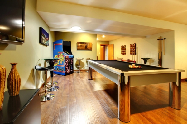 basement party room with pool table and arcade depicting sound proofing