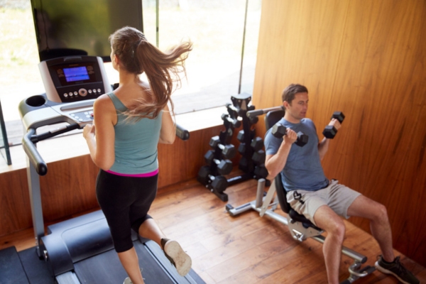 couple working out together at home gym