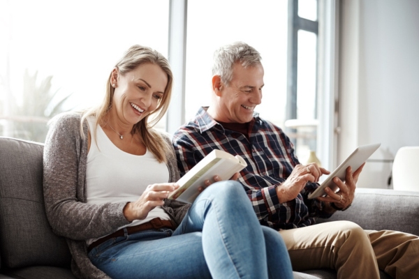 couple lounging indoors depicting passive cooling and proper insulation