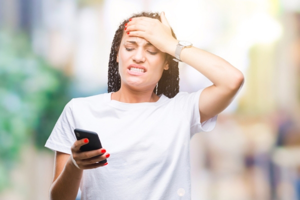 woman looking worried getting ready to call for professional insulation services