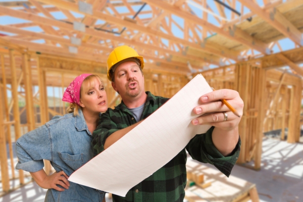 builder explaining to homeowner depicting understanding home insulation