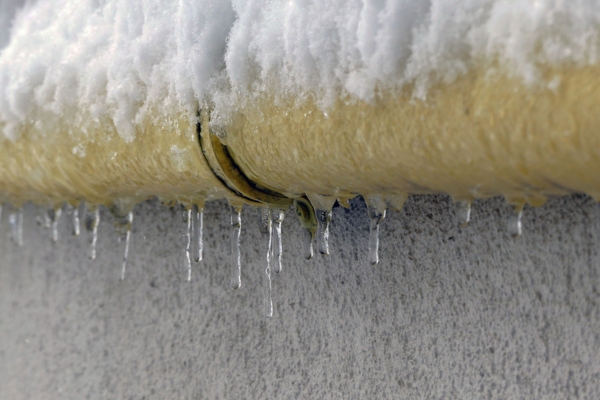 frozen pipes with icicles formation due to lack of insulation